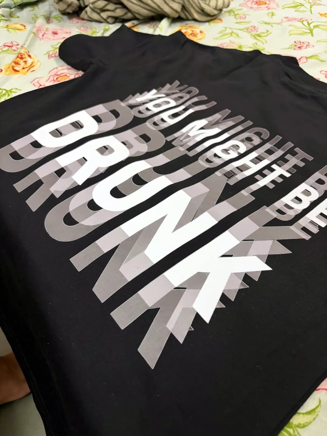 Black tee with a large gradient type print