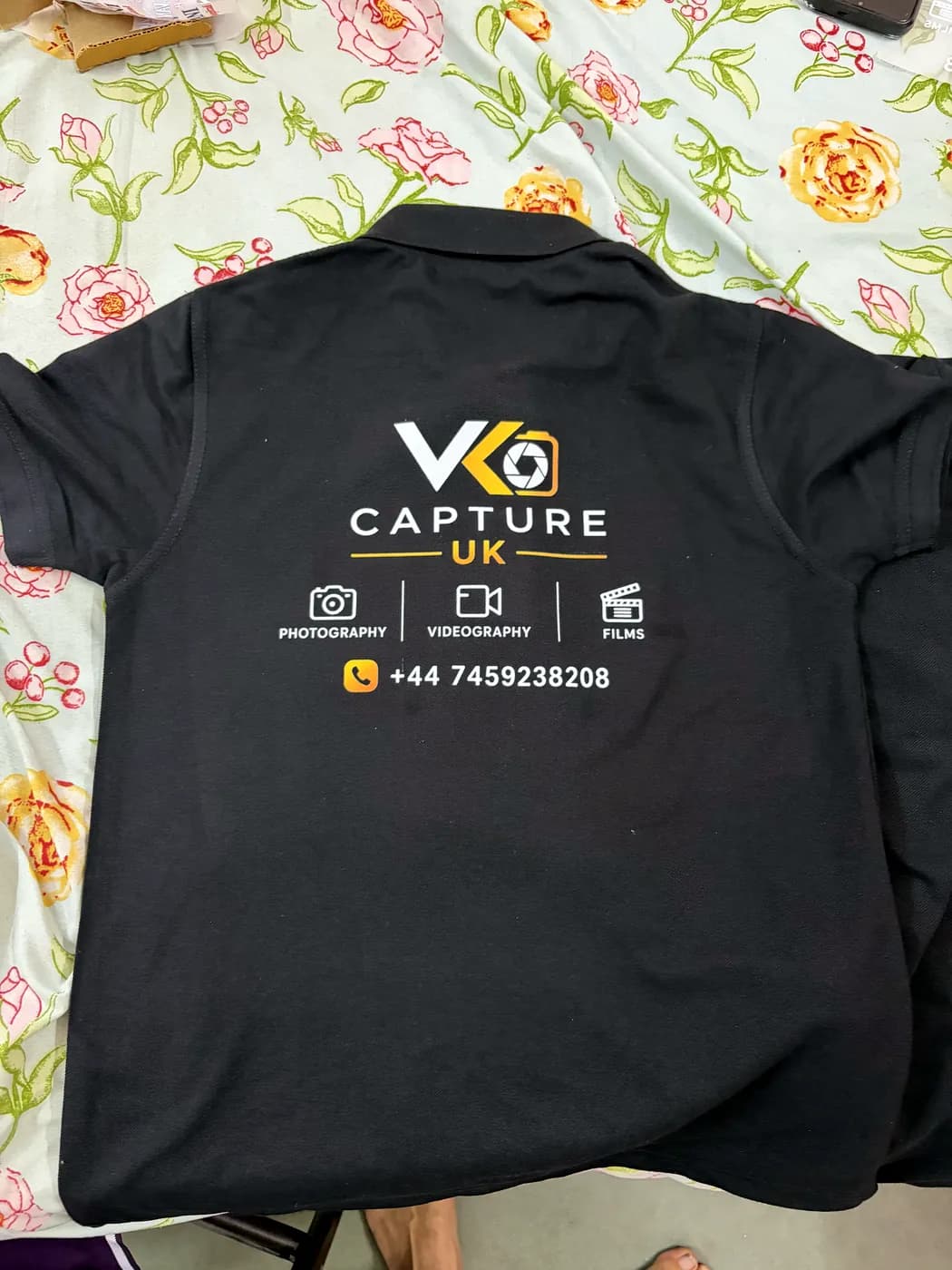 Black polo with a full-colour back print